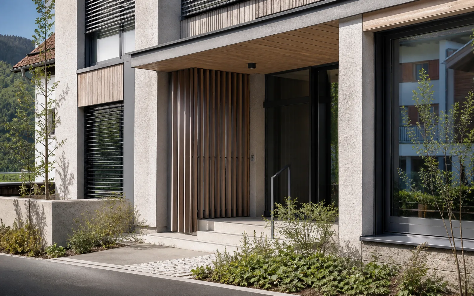 Konzeptvisualisierung eines zeitgemäßen Gebäudeeingangs mit Holz- und Mineralfassade.